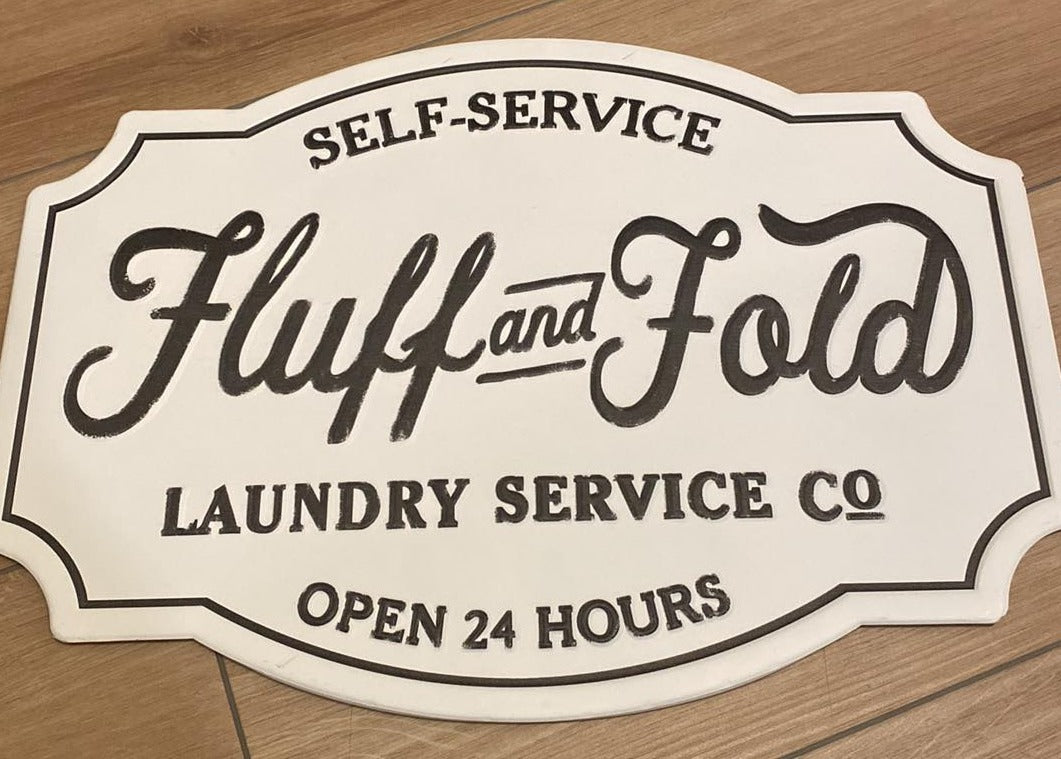FLUFF AND FOLD LAUNDRY CO SIGN