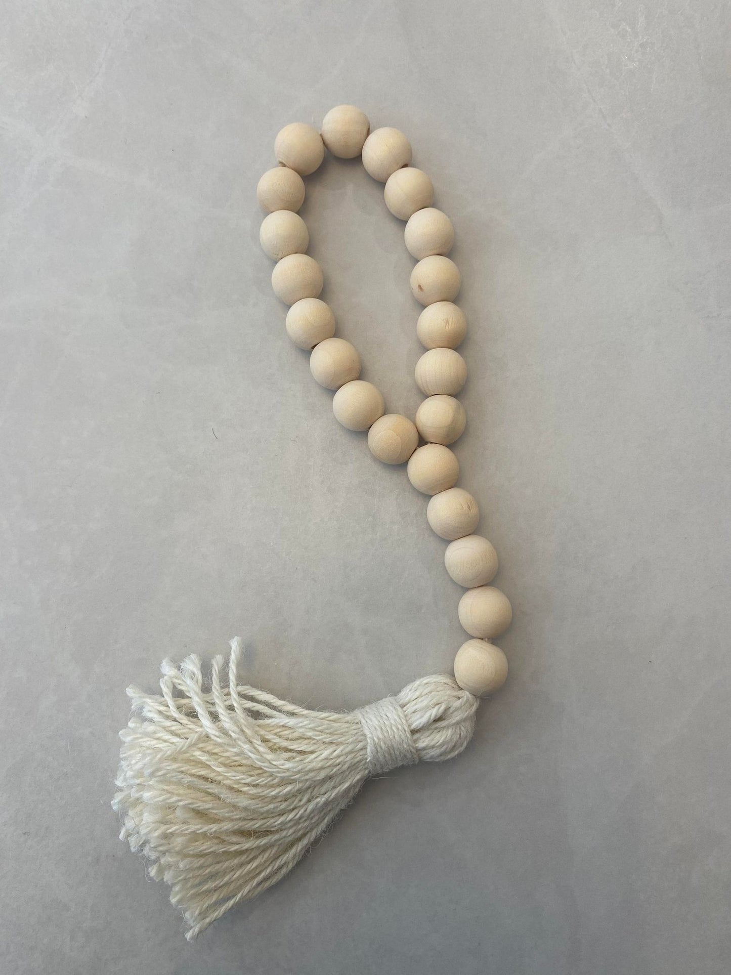 NATURAL BEADS W/ SHORT LOOP TASSLE