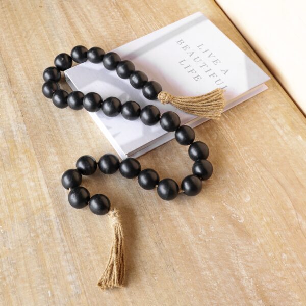 1.6" BLACK BEADS W/ JUTE TASSLE