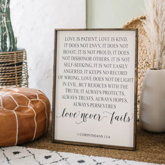 LOVE NEVER FAILS WOOD SIGN