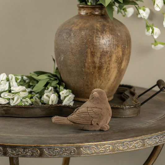 BROWN FLOCKED BIRD